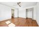 Bedroom featuring hardwood floors, white trim, closet and a ceiling fan at 1771 Mount Vernon Rd, Atlanta, GA 30338