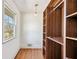 Walk-in closet features custom shelving and storage solutions with bright window view at 1771 Mount Vernon Rd, Atlanta, GA 30338