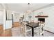 Inviting dining room showcasing a fireplace, a modern light fixture, and an open kitchen view at 1771 Mount Vernon Rd, Atlanta, GA 30338