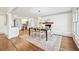 Elegant dining room with fireplace, hardwood floors, and a seamless transition to the kitchen at 1771 Mount Vernon Rd, Atlanta, GA 30338