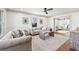 Bright living room with decorative molding, ceiling fan and hardwood floors at 1771 Mount Vernon Rd, Atlanta, GA 30338