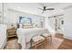 Light and airy main bedroom with a ceiling fan, hardwood floors, and bright windows at 1771 Mount Vernon Rd, Atlanta, GA 30338