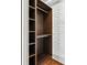 Spacious closet with shelving, with painted white brick accent wall at 1771 Mount Vernon Rd, Atlanta, GA 30338