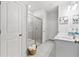 Elegant bathroom features a glass shower and a double vanity with modern fixtures at 3903 Shelleydale Dr, Powder Springs, GA 30127
