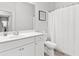 Clean bathroom features a white vanity and a shower with white tile and glass doors at 3903 Shelleydale Dr, Powder Springs, GA 30127