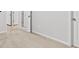 Neutral bedroom features an open doorway and plush carpet flooring at 3903 Shelleydale Dr, Powder Springs, GA 30127