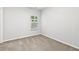 Neutral bedroom with carpet, a window, and fresh paint at 3903 Shelleydale Dr, Powder Springs, GA 30127
