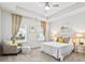 Cozy bedroom features natural light, a ceiling fan, and plush carpet flooring at 3903 Shelleydale Dr, Powder Springs, GA 30127