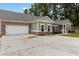 Charming one-story home with brick and siding, two-car garage and a spacious concrete driveway at 3903 Shelleydale Dr, Powder Springs, GA 30127