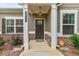Welcoming front entrance featuring craftsman details, a charming porch, and well-maintained landscaping at 3903 Shelleydale Dr, Powder Springs, GA 30127