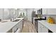 Spacious kitchen with island, white countertops, stainless steel appliances, and modern design at 3903 Shelleydale Dr, Powder Springs, GA 30127
