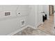 White laundry room with tile flooring, shelving and washer dryer hookups at 3903 Shelleydale Dr, Powder Springs, GA 30127