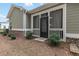 Exterior view of screened porch with black door at 3903 Shelleydale Dr, Powder Springs, GA 30127