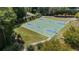 Outdoor basketball court featuring pristine landscaping with multiple hoops, surrounded by greenery and a sidewalk at 918 Bridge Mill Ave, Canton, GA 30114