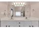 Bathroom features double sinks and white cabinets at 918 Bridge Mill Ave, Canton, GA 30114