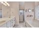 Bathroom with double sinks, soaking tub and glass shower at 918 Bridge Mill Ave, Canton, GA 30114