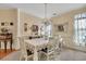 Bright dining room featuring a chandelier, and a table with seating for six at 918 Bridge Mill Ave, Canton, GA 30114