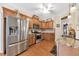 Updated kitchen with stainless steel appliances, granite countertops, and wooden cabinetry at 918 Bridge Mill Ave, Canton, GA 30114
