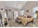 Bright main bedroom features a vaulted ceiling, floral bedding, and ensuite bathroom at 918 Bridge Mill Ave, Canton, GA 30114