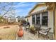Charming outdoor patio with a seating area, flower arrangements, and retractable awning for shade at 918 Bridge Mill Ave, Canton, GA 30114