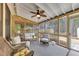 Comfortable screened porch with ceiling fan, neutral furniture, and natural light, perfect for relaxing at 918 Bridge Mill Ave, Canton, GA 30114