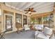 Cozy screened porch with comfortable seating, ceiling fan, and view of the outdoor scenery at 918 Bridge Mill Ave, Canton, GA 30114