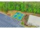 Aerial view of tennis courts featuring fresh landscaping, parking and a corner view of the club house at 918 Bridge Mill Ave, Canton, GA 30114