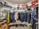 Walk-in closet features wrap around shelving and ample space for clothing at 918 Bridge Mill Ave, Canton, GA 30114
