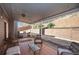 Covered back porch with stone patio and plenty of seating for outdoor enjoyment at 4275 Chastain Pointe Nw, Kennesaw, GA 30144