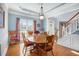 Cozy dining room featuring hardwood floors, wainscoting, and tray ceiling at 4275 Chastain Pointe Nw, Kennesaw, GA 30144