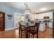 Casual eat-in kitchen features modern white cabinets, dark countertops, and lake view at 4275 Chastain Pointe Nw, Kennesaw, GA 30144