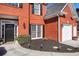 Close-up of brick home with landscaped entrance and a two-car garage at 4275 Chastain Pointe Nw, Kennesaw, GA 30144