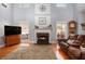Spacious living room with hardwood floors, fireplace, and large windows at 4275 Chastain Pointe Nw, Kennesaw, GA 30144