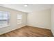 Well-lit bedroom with wood flooring and bright windows at 4593 Parkway Cir, Atlanta, GA 30349