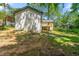 A home's backyard featuring a covered patio and lush greenery at 2133 Trailwood Rd, Decatur, GA 30032