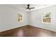 Bedroom with hardwood floors and two large windows at 2133 Trailwood Rd, Decatur, GA 30032