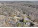 Aerial view of a lovely neighborhood surrounded by lush trees and greenery at 2984 Superior Dr, Dacula, GA 30019