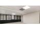 Basement featuring carpet flooring with built-in shelving and cabinet, illuminated by a ceiling light at 2984 Superior Dr, Dacula, GA 30019
