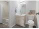 Cozy bathroom featuring a shower and a vanity with a framed mirror at 2984 Superior Dr, Dacula, GA 30019