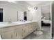 Bathroom featuring double sinks, and view into Primary bedroom at 2984 Superior Dr, Dacula, GA 30019