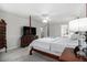 Spacious bedroom with a four-poster bed, dresser, carpeted floor, and a ceiling fan at 2984 Superior Dr, Dacula, GA 30019