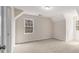 Neutral bedroom featuring a window for natural light and plush carpeting at 2984 Superior Dr, Dacula, GA 30019