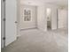 Open bedroom featuring a window for natural light and plush carpeting at 2984 Superior Dr, Dacula, GA 30019