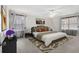 Cozy bedroom featuring neutral walls, carpet and three large windows for natural light at 2984 Superior Dr, Dacula, GA 30019