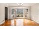 Bright dining area with hardwood floors, chandelier, and large bay window offering plenty of natural light at 2984 Superior Dr, Dacula, GA 30019