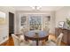 Elegant dining room featuring a large bay window, wood floors, and traditional finishes at 2984 Superior Dr, Dacula, GA 30019