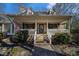 Charming front porch with brick steps, white columns, and mature landscaping at 2984 Superior Dr, Dacula, GA 30019