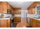 Traditional kitchen with stainless steel appliances, wood cabinets and bright countertops at 2984 Superior Dr, Dacula, GA 30019