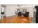 Living room featuring hardwood floors, a fireplace, and open access to other rooms at 2984 Superior Dr, Dacula, GA 30019