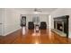 Spacious living room with hardwood floors, a fireplace, and ample natural light at 2984 Superior Dr, Dacula, GA 30019